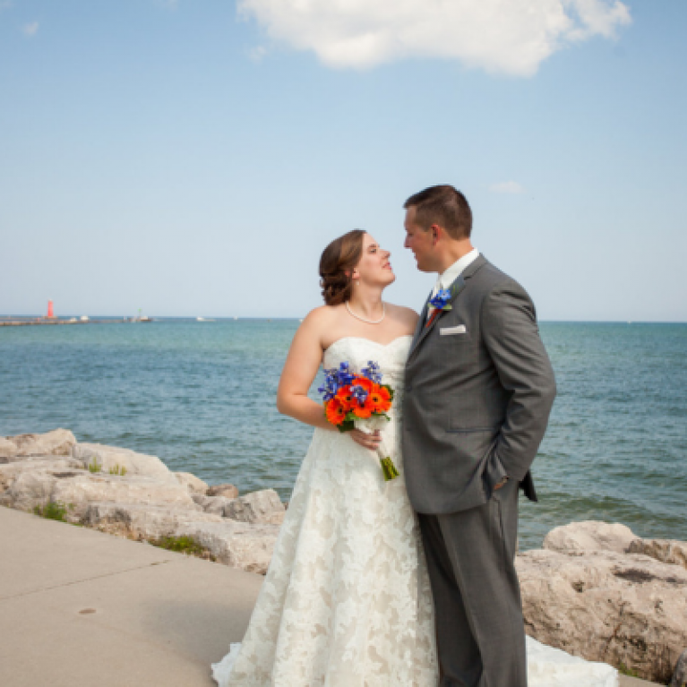 BRIDE AND GROOM ON BEACH AT BLUE HARBOR RESORT WEDDING