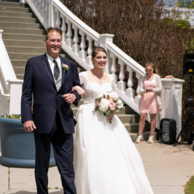 GRAND STAIRCASE ENTRANCE BRIDE AT BLUE HARBOR RESORT WEDDING